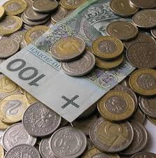 Zdjęcie przedstawiające monety i jeden banknot.